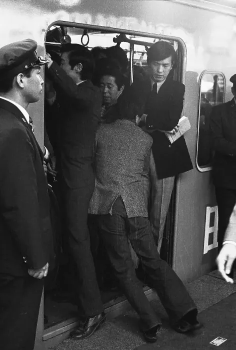 Framed Print : A Japanese Commuter Pushes Onto Train Framed Print : A Japanese Commuter Pushes Onto Train