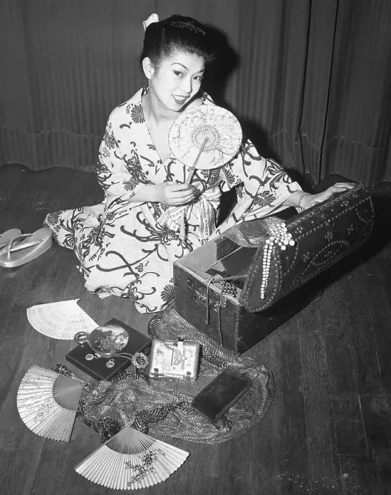 Framed Print : Japanese Woman Looking at Her Mementos Framed Print : Japanese Woman Looking at Her Mementos