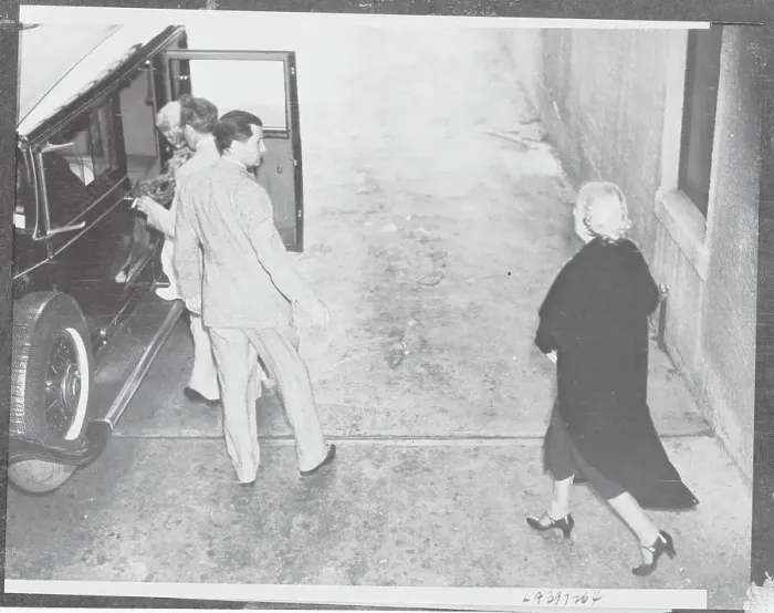 Framed Print : Jean Bello Entering Car Assisted by Ex-Husband Framed Print : Jean Bello Entering Car Assisted by Ex-Husband