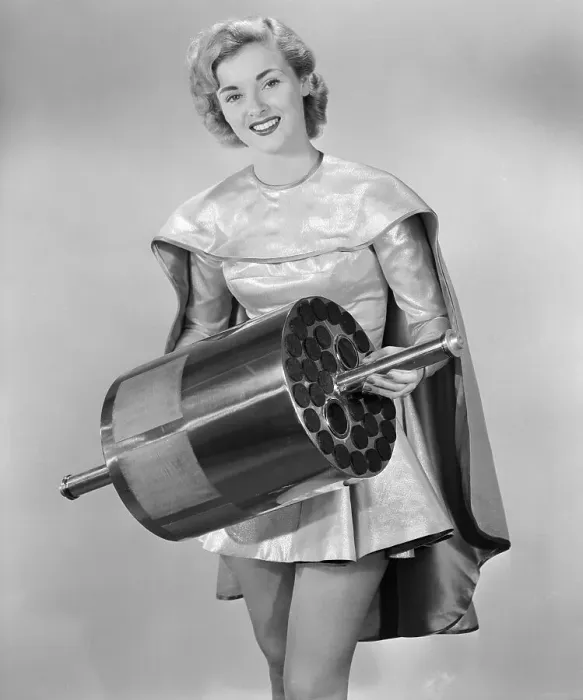 Framed Print : Jean Moorehead Holding a Earth Satellite Framed Print : Jean Moorehead Holding a Earth Satellite
