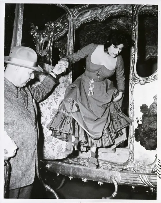 Framed Print : Jean Renoir Helps Anna Magnani from Coach Framed Print : Jean Renoir Helps Anna Magnani from Coach