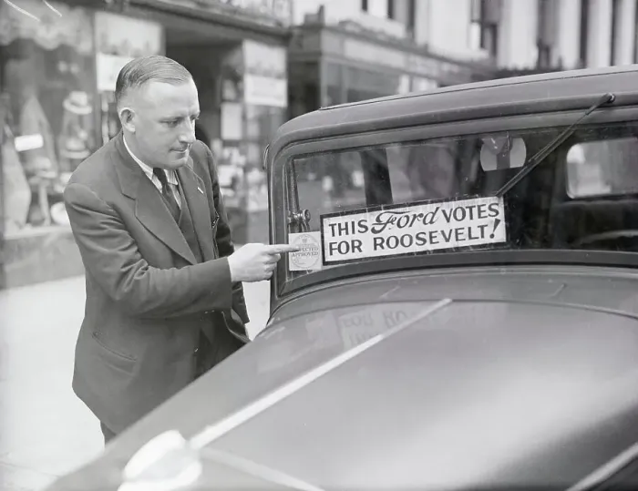 Framed Print : Jerome T. Harriman Pointing to Sticker on Car Framed Print : Jerome T. Harriman Pointing to Sticker on Car