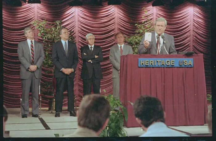 Framed Print : Jerry Falwell Showing Card at Press Conference