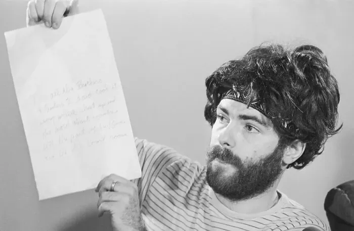 Framed Print : Jerry Rubin Holds Note From Bobby Seale Framed Print : Jerry Rubin Holds Note From Bobby Seale