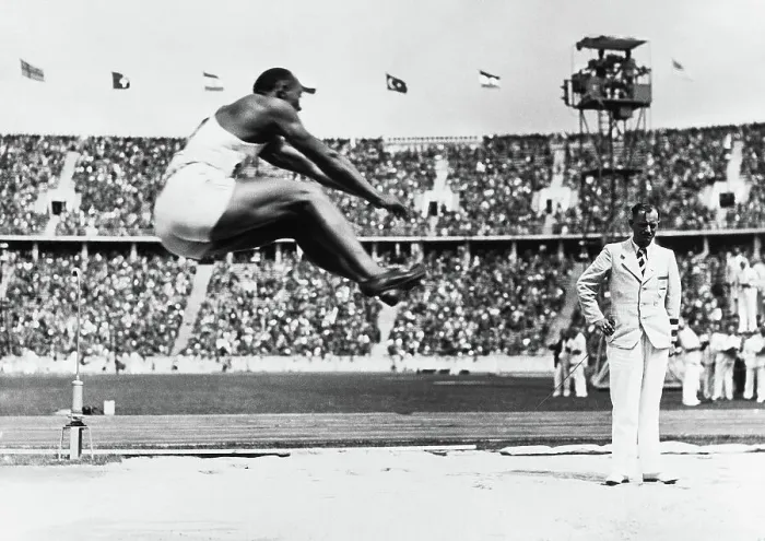 Framed Print : Jesse Owens Competing in Long Jump Framed Print : Jesse Owens Competing in Long Jump