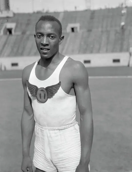 Framed Print : Jesse Owens Posing Beside Track Framed Print : Jesse Owens Posing Beside Track