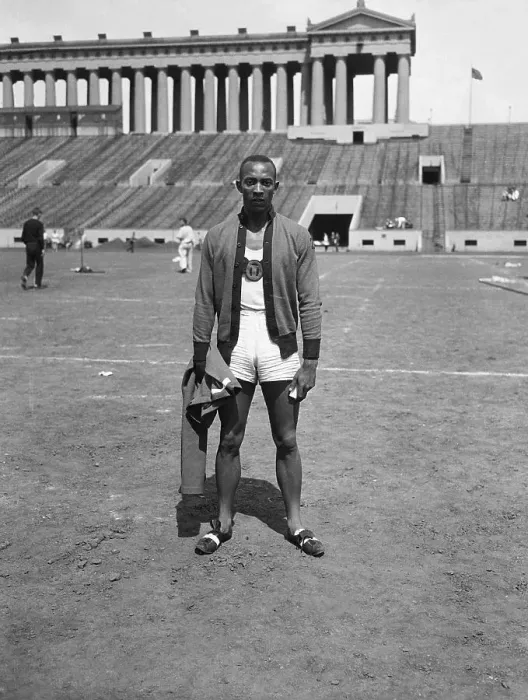 Framed Print : Jesse Owens Posing Beside Track Framed Print : Jesse Owens Posing Beside Track