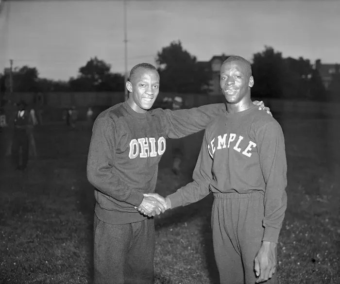 Framed Print : Jesse Owens Shaking Hands with Eulace Peacock