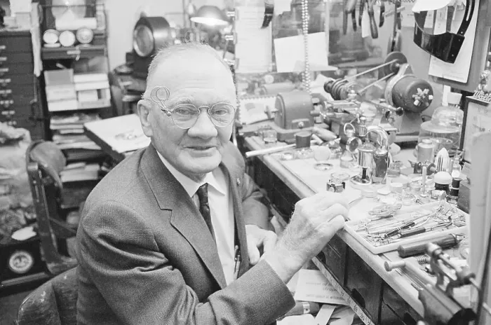 Framed Print : Jeweller Seated at Workbench Framed Print : Jeweller Seated at Workbench