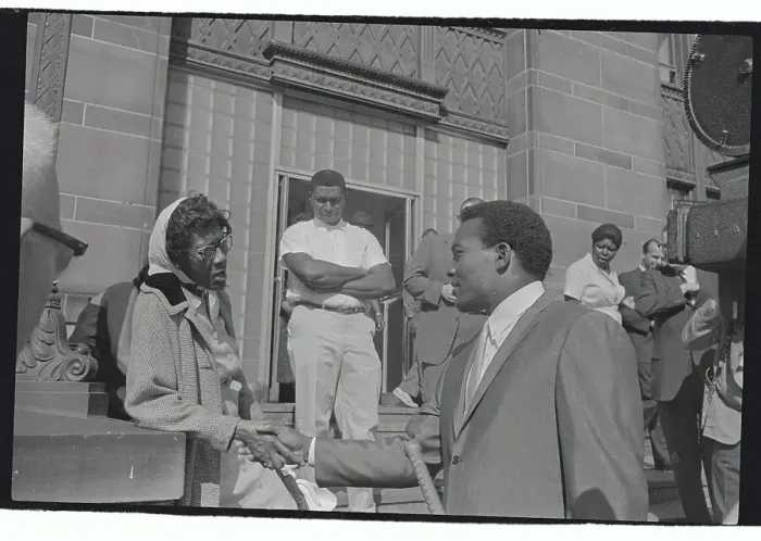 Framed Print : Jim Brown Shaking Hands with an unidentified Woman Framed Print : Jim Brown Shaking Hands with an unidentified Woman