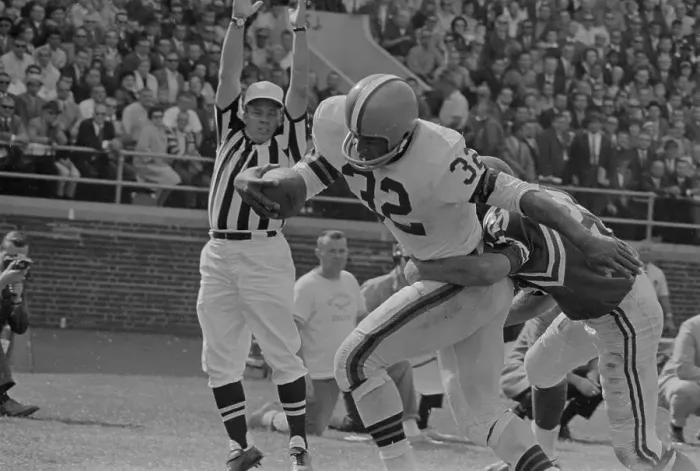 Framed Print : Jim Brown Being Tackled by Opponents Framed Print : Jim Brown Being Tackled by Opponents