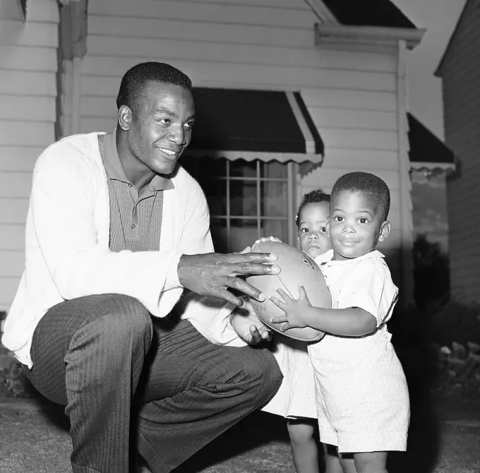 Framed Print : Jim Brown With Twin Children And Football Framed Print : Jim Brown With Twin Children And Football