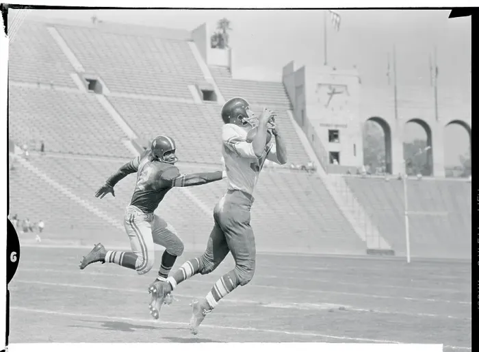 Framed Print : Jim Haggerty Catching a Pass Framed Print : Jim Haggerty Catching a Pass