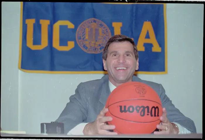 Framed Print : Jim Harrick Posing with Basketball