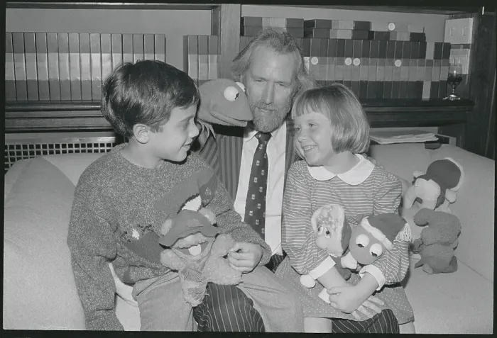 Framed Print : Jim Henson Offering Gifts to Children Framed Print : Jim Henson Offering Gifts to Children