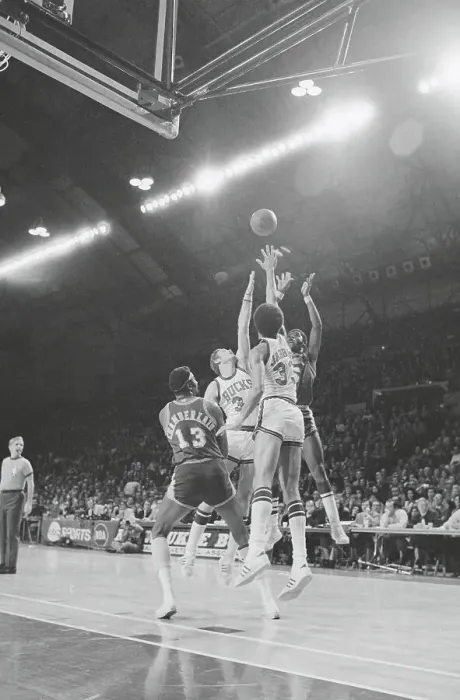 Framed Print : Jim McMillen Shooting Over Players