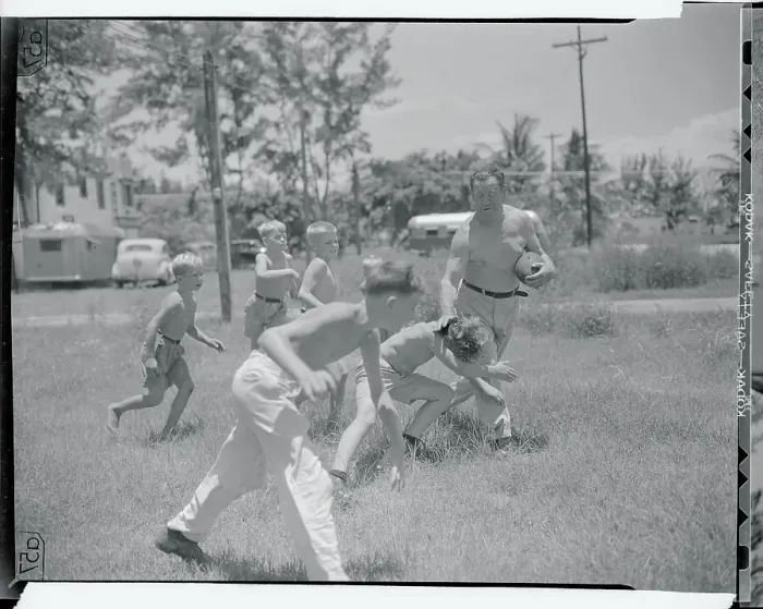 Framed Print : Jim Thorpe Playing Football with Children Framed Print : Jim Thorpe Playing Football with Children