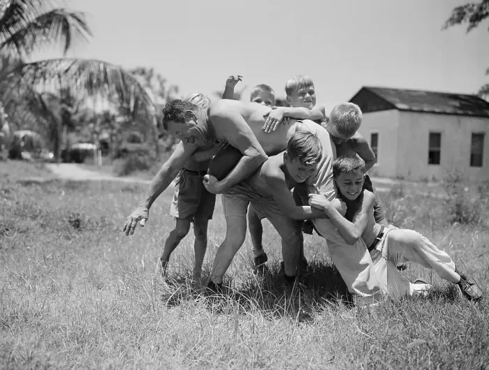 Framed Print : Jim Thorpe Playing Football with Children Framed Print : Jim Thorpe Playing Football with Children