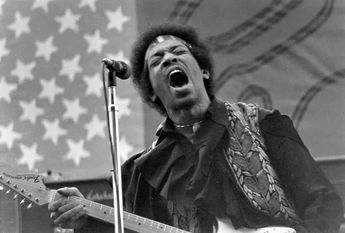 Framed Print : Jimi In Front Of An American Flag Framed Print : Jimi In Front Of An American Flag