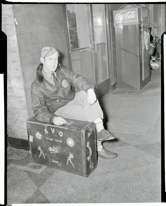 Framed Print : Jimmie Allard Sitting in Uniform With Suitcase