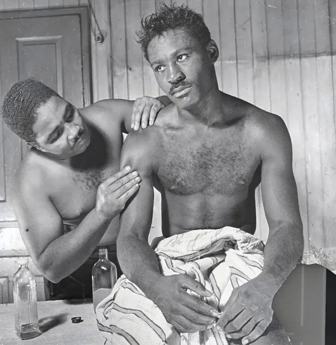 Framed Print : Jimmy Brown Examining Ezzard Charles Arm Framed Print : Jimmy Brown Examining Ezzard Charles Arm