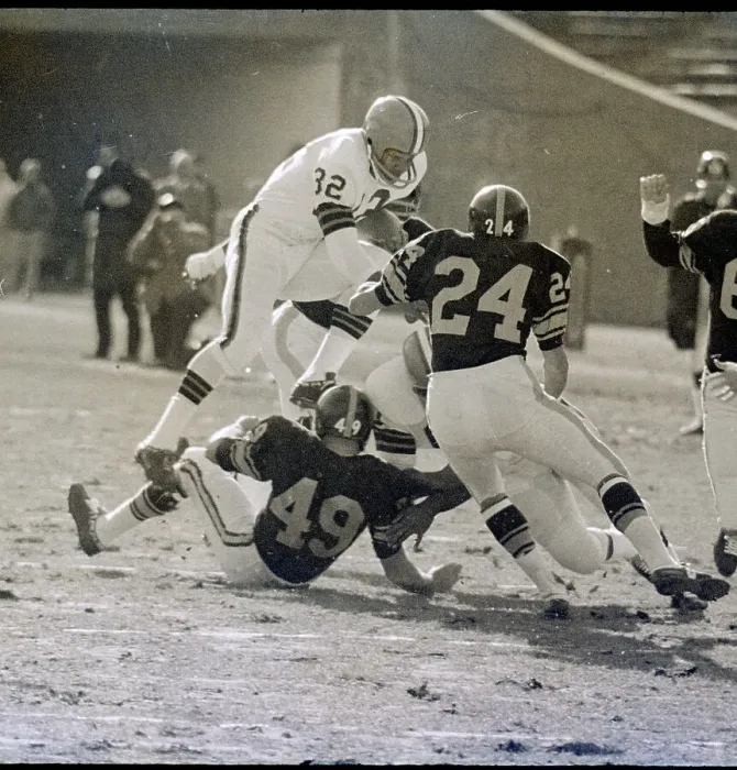 Framed Print : Jimmy Brown Stepping Over Bob Sherman