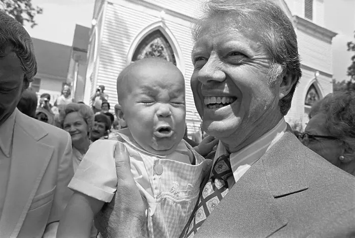 Framed Print : Jimmy Carter Holds Crying Baby Framed Print : Jimmy Carter Holds Crying Baby