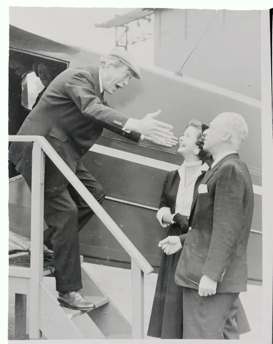 Framed Print : Joan Bennett and Husband Welcoming John Huston Framed Print : Joan Bennett and Husband Welcoming John Huston