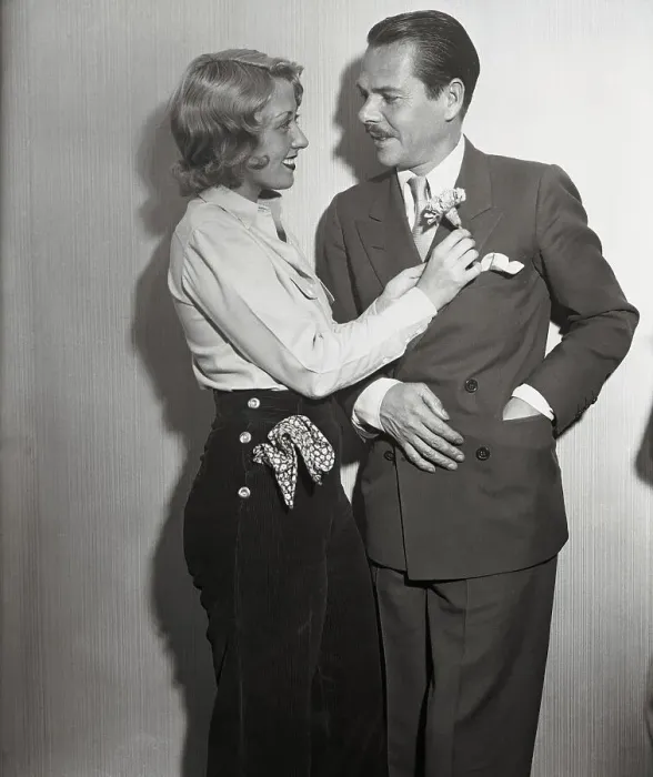 Framed Print : Joan Blondell Placing Flower on Husband's Lapel Framed Print : Joan Blondell Placing Flower on Husband's Lapel