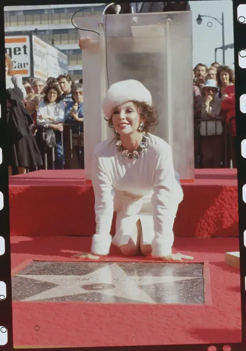 Framed Print : Joan Collins Posing with Her Star on Hollywood Boulevard Framed Print : Joan Collins Posing with Her Star on Hollywood Boulevard