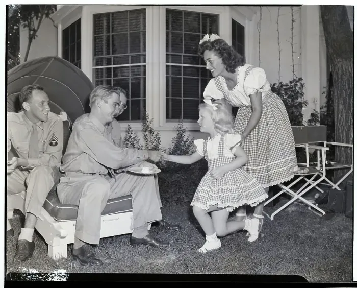 Framed Print : Joan Crawford and Daughter Christina with Servicemen Framed Print : Joan Crawford and Daughter Christina with Servicemen
