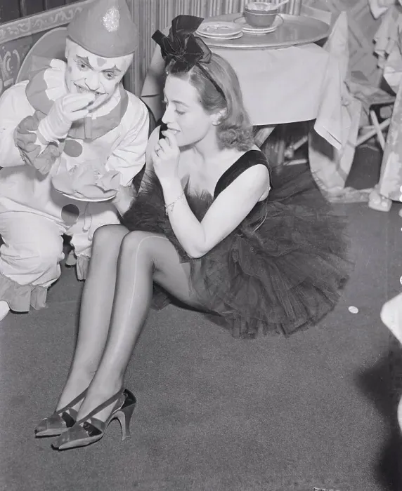 Framed Print : Joan Crawford Eating Cookie with Clown Framed Print : Joan Crawford Eating Cookie with Clown
