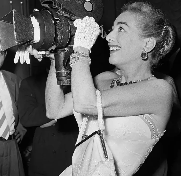 Framed Print : Joan Crawford Jokingly Handling a Camera