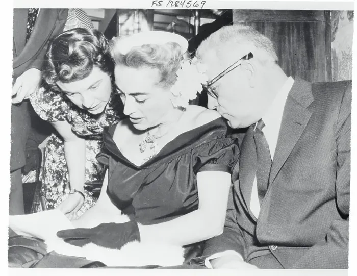 Framed Print : Joan Crawford Signing an Autograph Book Framed Print : Joan Crawford Signing an Autograph Book
