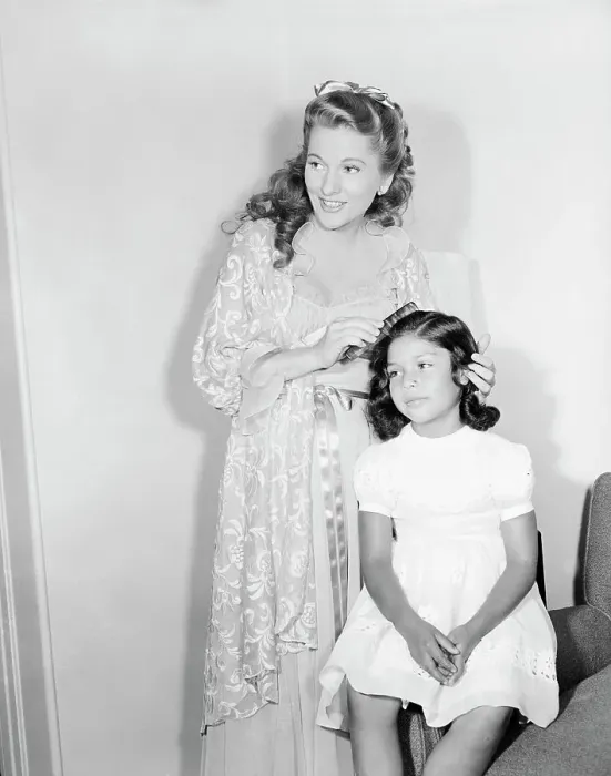 Framed Print : Joan Fontaine Combing Daughter's Hair Framed Print : Joan Fontaine Combing Daughter's Hair