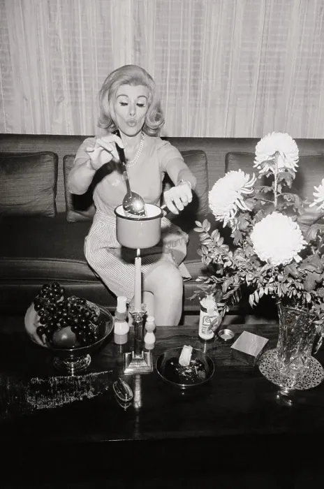 Framed Print : Joan Rivers Cooking over a Candle