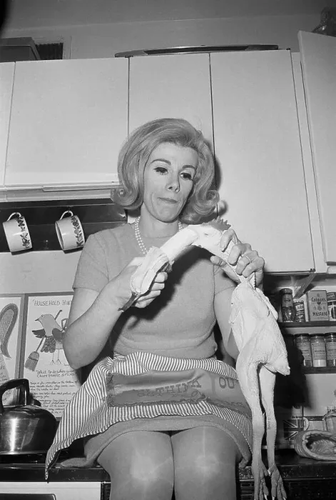 Framed Print : Joan Rivers Stuffing Banana into Chicken Framed Print : Joan Rivers Stuffing Banana into Chicken