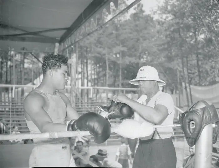 Framed Print : Joe Blackburn Removing Joe Louis Gloves