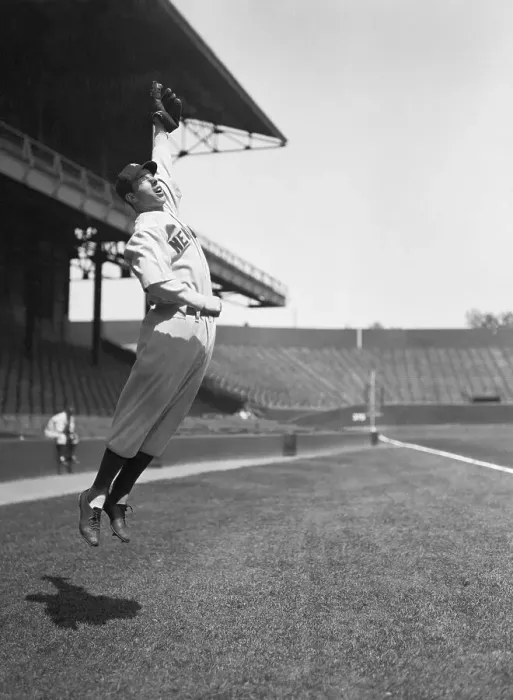 Framed Print : Joe DiMaggio Jumping To Catch Baseball