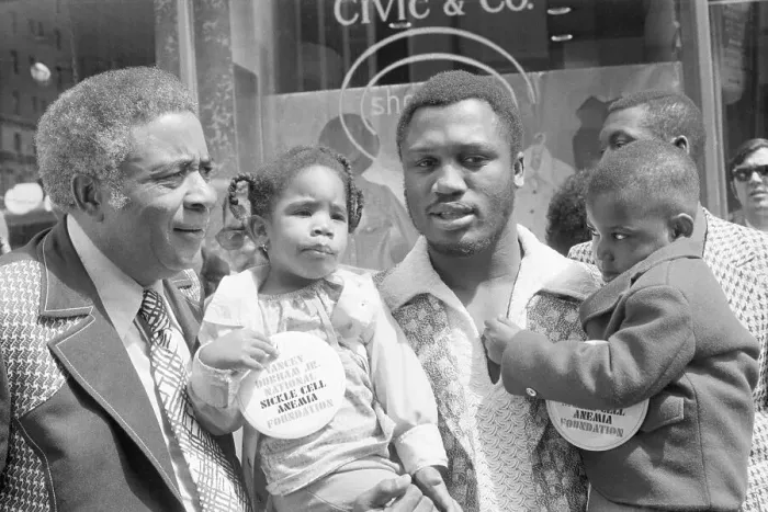 Framed Print : Joe Frazier Holds Two Kids with Sickle Cell Framed Print : Joe Frazier Holds Two Kids with Sickle Cell