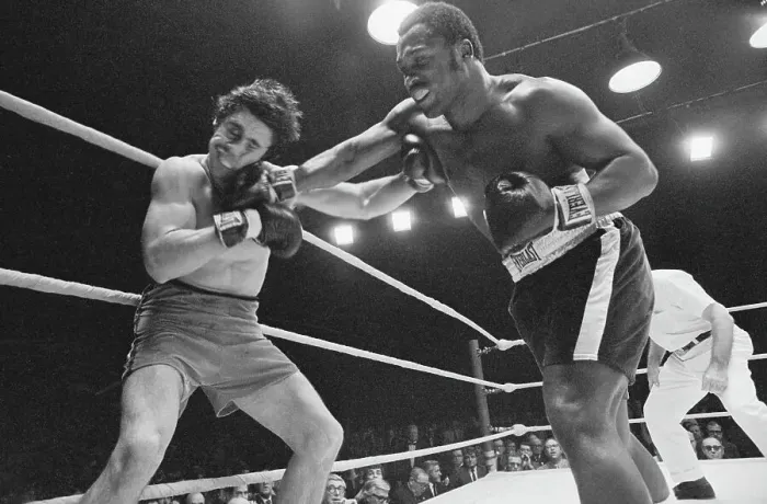 Framed Print : Joe Frazier and Terry Daniels in Boxing Action