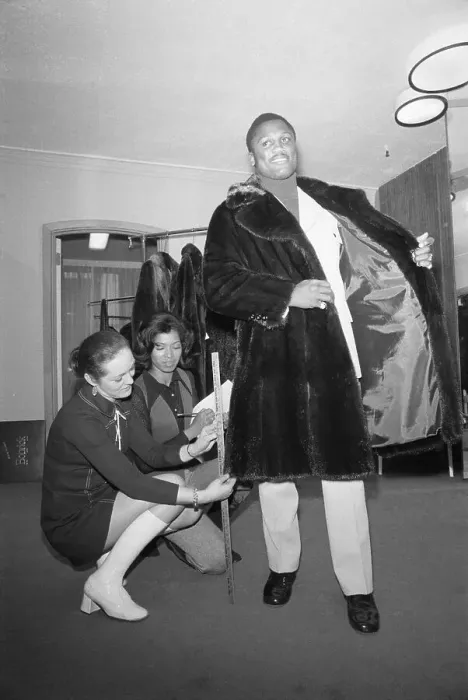 Framed Print : Joe Frazier Trying On Coat Framed Print : Joe Frazier Trying On Coat