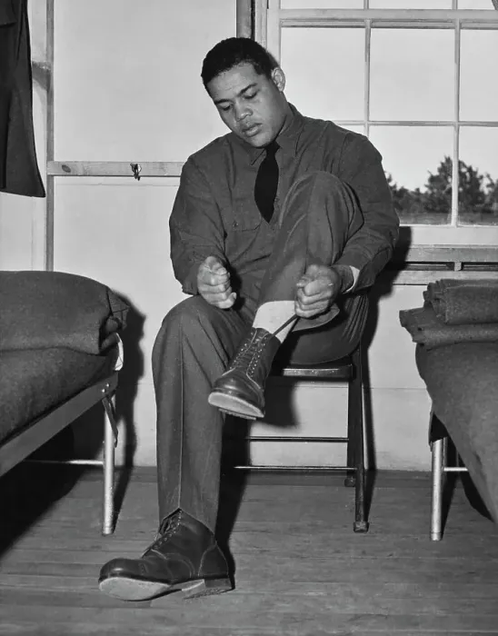Framed Print : Joe Louis. American boxing champion Joe Louis tying a shoelace in his US Framed Print : Joe Louis. American boxing champion Joe Louis tying a shoelace in his US