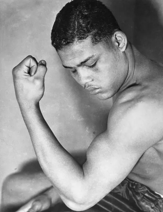Framed Print : Joe Louis Examining His Muscle Framed Print : Joe Louis Examining His Muscle