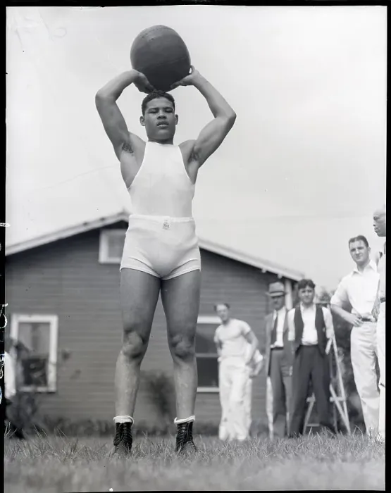 Framed Print : Joe Louis Holds Medicine Ball Above Head