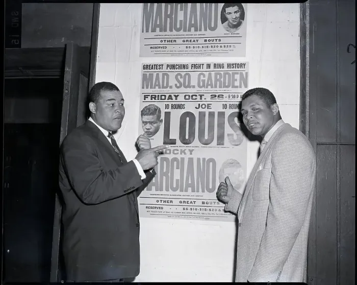 Framed Print : Joe Louis Points to Old Fight Poster Framed Print : Joe Louis Points to Old Fight Poster