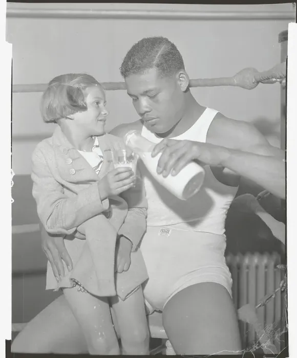 Framed Print : Joe Louis Pouring Milk for Girl Framed Print : Joe Louis Pouring Milk for Girl