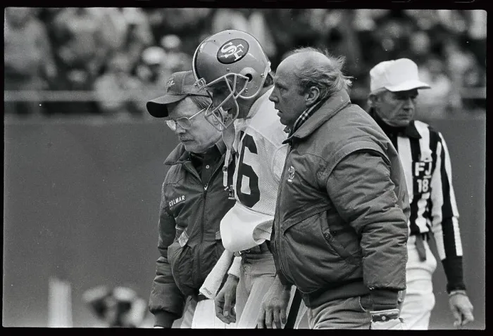 Framed Print : Joe Montana Being Helped from Field Framed Print : Joe Montana Being Helped from Field