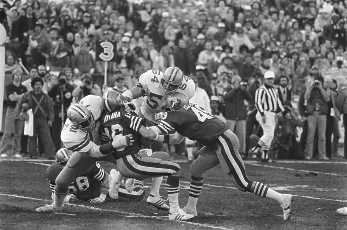 Framed Print : Joe Montana Being Sacked by Multiple Opponents Framed Print : Joe Montana Being Sacked by Multiple Opponents