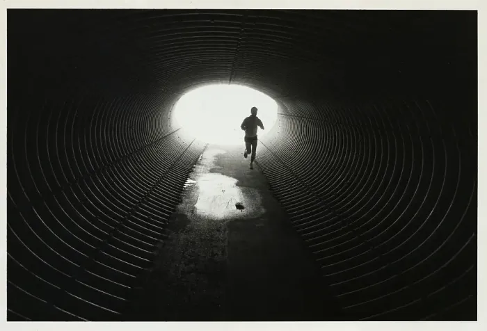 Framed Print : Jogger Entering Darkened Tunnel Framed Print : Jogger Entering Darkened Tunnel